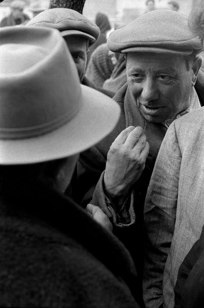 Frank Cancian. In the piazza 3 (Lacedonia Photos). 1957. Black-and-white photograph. © 2001 Frank Cancian. Image and data provided by University of California Irvine Libraries.