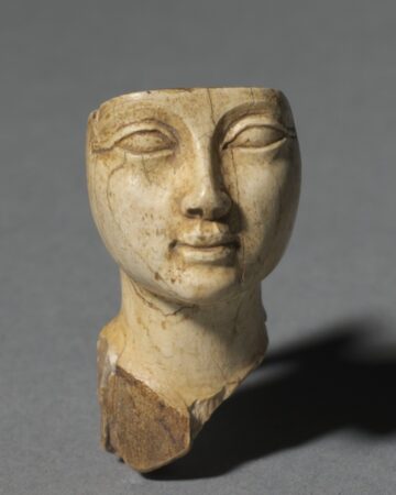 Egypt, New Kingdom, Dynasty 18, reign of Amenhotep III. Face from a Cosmetic Spoon. 1391-1353 BCE.