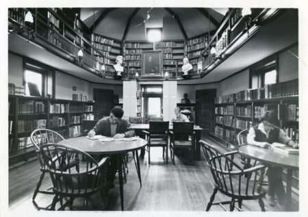 Photograph of students and a woman reading in the Joseph Krauskopf Memorial Library