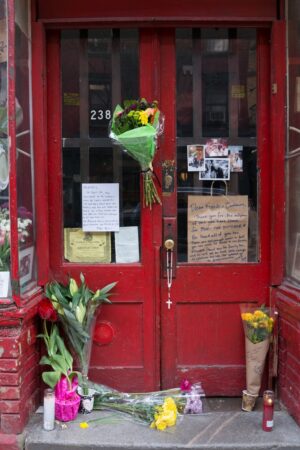 Flowers in front of storefront in Little Italy, NY