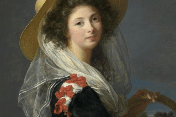 A portrait of a woman wearing a wide-brimmed straw hat and a sheer white shawl, holding a basket of grapes, set against a soft gray-blue background.