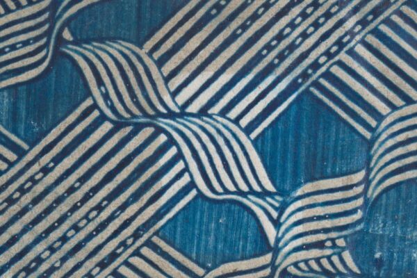 Abstract weaving of a blue background and white bands.