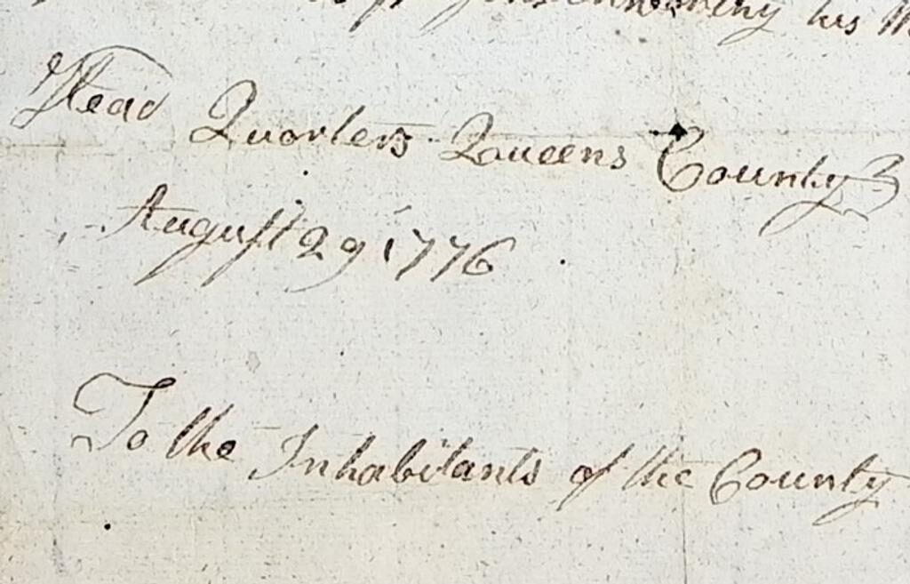 Close-up of a handwritten document dated August 29, 1776, from Queens County. The text reads in part “Head Quarters Queens County August 29, 1776” and begins “To the Inhabitants of the County,” written in cursive ink on aged paper.
