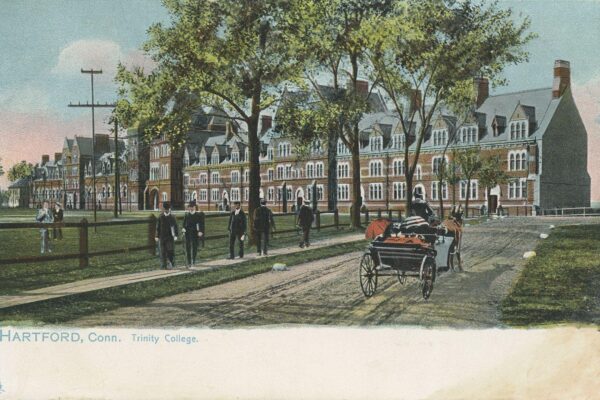 Color postcard of Trinity College in Hartford, Connecticut, showing a large Gothic-style campus building, pedestrians, and a horse-drawn carriage along a tree-lined street.